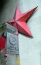 German Democratic Republic sign and red star near Checkpoint Charlie between east and west sectors during the Cold War