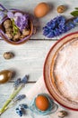 German Easter cake, eggs, flowers, ribbons on the table Royalty Free Stock Photo