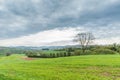 German Eifel landscape in spring with gentle slopes and budding green of trees