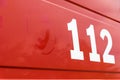 German emergency number on a red background with copy space Royalty Free Stock Photo