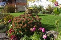 german farmhouse with autumn colors and decoration of garden