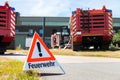 German Feuerwehr fire department sign stands near fire trucks