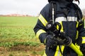 German Firefighter with water hose in action Royalty Free Stock Photo