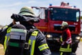 German fireman Feuerwehr stands near an accident