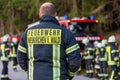 German firemen stands near a fire truck during an exercise Royalty Free Stock Photo