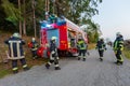 German firemen stands near a fire truck during an exercise Royalty Free Stock Photo