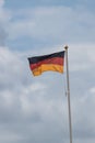 A german flag flying from a flagpole Royalty Free Stock Photo