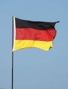 German flag flying on flagpole Royalty Free Stock Photo