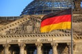 The German flag in front of the Reichstag building in Berlin. The inscription says: Dem Deutschen Volke - To the German people Royalty Free Stock Photo