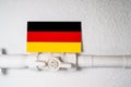German flag on a gas pipeline symbolizing energy cut-off from Russia to the European Union. Royalty Free Stock Photo
