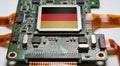 German flag on a GPU microchip placed on a detailed PCB board, high-tech macro shot. Royalty Free Stock Photo