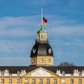 German Flag at Halfmast, auf Halbmast, on the top of Castle Karlsruhe at winter. In Karlsruhe, Baden-WÃÂ¼rttemberg, Germany Royalty Free Stock Photo