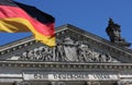 German flag next to the Reichstag Building in Berlin, Germany Royalty Free Stock Photo