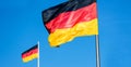 German flags in strong wind panorama