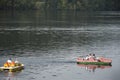 German and foreigner travelers people playing and paddle boat in lake