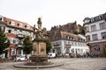 German and foreigner travelers people walking and visit madonna statue at the corn market in Heidelberg, Germany