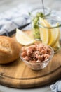 German Friesland north sea brown shrimps in glass bowl with cucumber salad, bread roll and lemon on wooden board Royalty Free Stock Photo