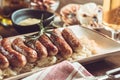 German Grilled Sausages with Cabbage Salad, Mustard and Beer Royalty Free Stock Photo