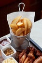 German hearty lunch in the pub.Grilled sausages, stewed cabbage, croutons, sauce. Beer snack