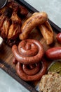 German hearty lunch in the pub.Grilled sausages, stewed cabbage, croutons, sauce. Beer snack