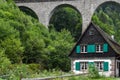 German house by stone train trestle Royalty Free Stock Photo