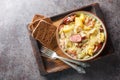 German Hunter Cabbage Stew with potatoes, sausage, bacon and onions close-up in a bowl on the table. Horizontal close-up in a bowl Royalty Free Stock Photo