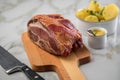 German Kassler pork neck with boiled potatoes and mustard on marble table