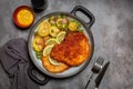 German lunch - schnitzel, potato salad with green beans and red onion