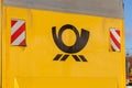 German mail service Deutsche Post logo on a yellow container