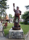 German man drinking beer. Statue tribute to the tradition and the beer spirit of Villa General Belgrano. Wooden statue in central