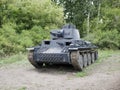 German medium tank of the Second World war in working order. the tank is painted black against a background of green trees in summ Royalty Free Stock Photo