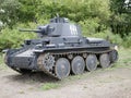 German medium tank of the Second World war in working order. the tank is painted black against a background of green trees in summ Royalty Free Stock Photo