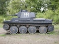 German medium tank of the Second World war in working order. the tank is painted black against a background of green trees in summ Royalty Free Stock Photo