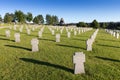 German military cemetery in autumn with mountains in the background and many graves of soldiers killed in the Second World War. Royalty Free Stock Photo