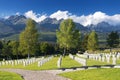 German military cemetery in autumn with mountains in the background and many graves of soldiers killed in the Second World War. Royalty Free Stock Photo