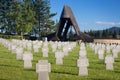 German military cemetery in autumn with mountains in the background and many graves of soldiers killed in the Second World War. Royalty Free Stock Photo