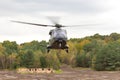 German military helicopter in flights over battlefield