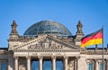 German National flag waving in front of German parliament building in Berlin Royalty Free Stock Photo