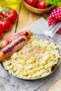 German noodles Spatzle with fried onions and sausages Royalty Free Stock Photo