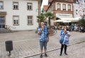 German old man and thai woman people show ice cream and eating at Speyer town