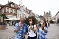 German old man and thai woman people show ice cream and eating at Speyer town