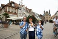 German old man and thai woman people show ice cream and eating at Speyer town