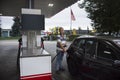 German old men people drive car go to fill oil in petrol station