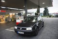 German old men people drive car go to fill oil in petrol station