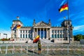 German parliament Reichstag and boy with deutsch flag, Berllin, Germany