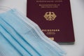 German passport with a blue protective mask