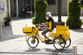 German people biking bicycle three wheels and cart send newspapers at Sandhausen village in Heidelberg