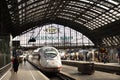 German people and foreign travelers walking waiting got to train in terminal at Dortmund Central Hauptbahnhof railway station on