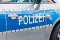 German police sign on the patrol car