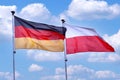 German and Polish flags waving together Royalty Free Stock Photo